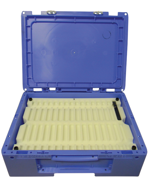 Machined solid plastic tray positioned within an open blue carrying case. The tray features precisely machined grooves designed for organizing and securely holding various items. The lid of the carrying case is open, revealing the interior tray's layout. This setup is ideal for storage, transportation, and organization of components or tools.