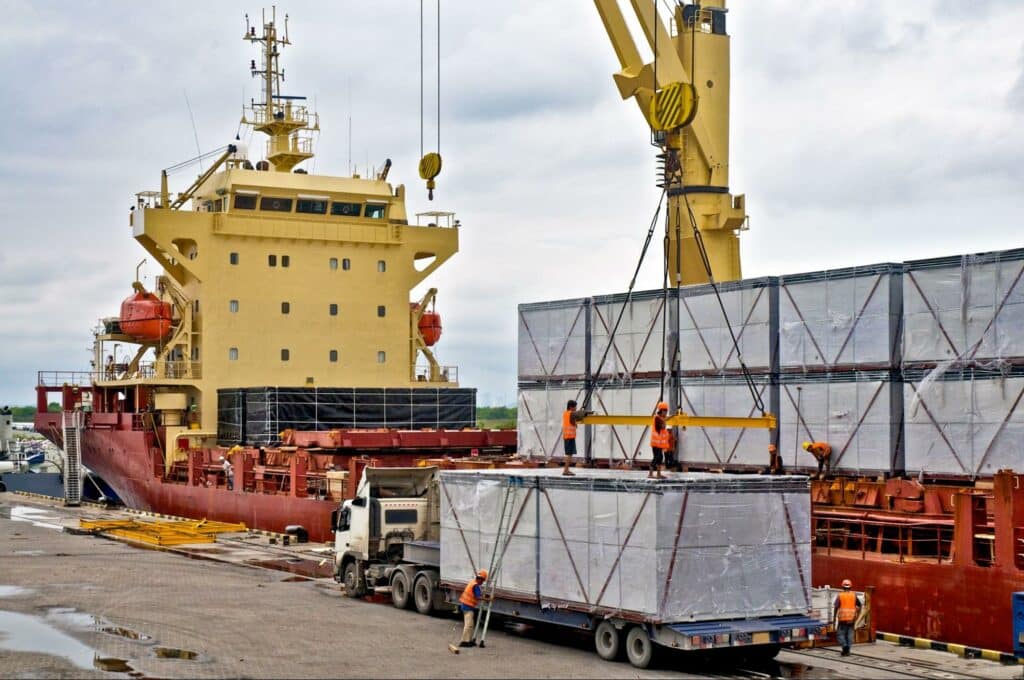 Cargo loading operations with a crane at the port, showcasing efficient logistics in action.