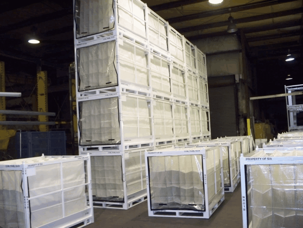 Efficient storage solutions with stacked containers in a warehouse setting.