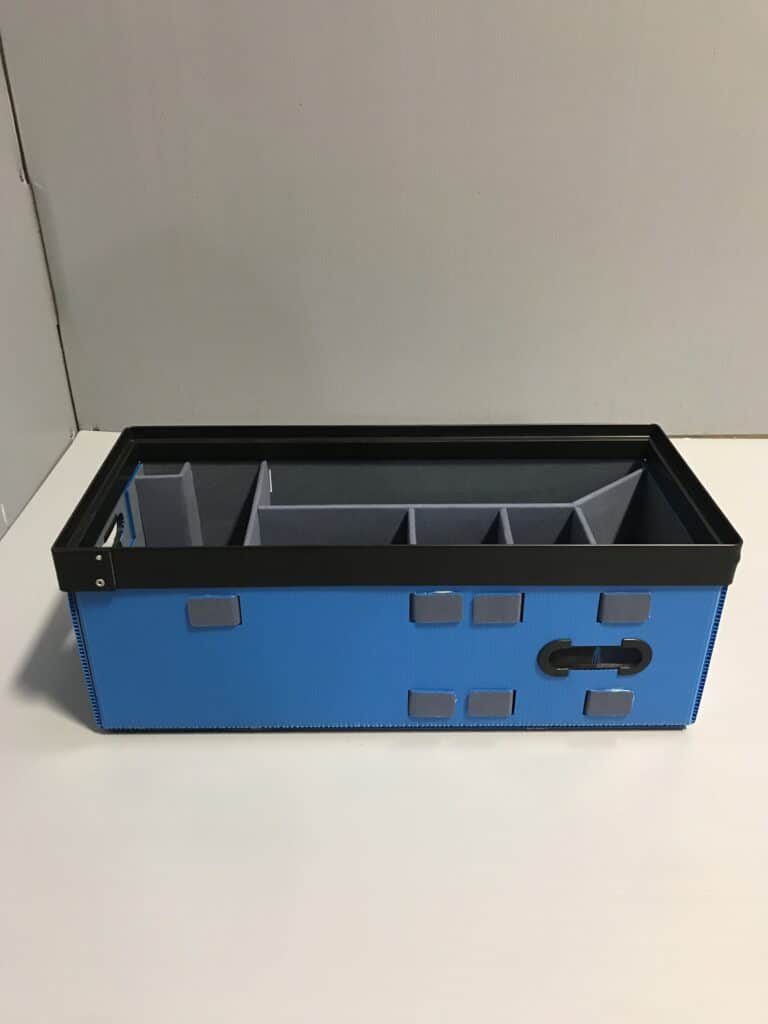 Durable blue storage bin with compartments for organized home and office organization.