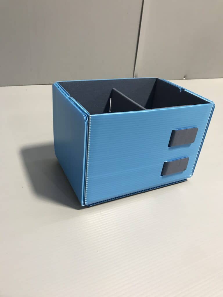 Blue storage box with dividers for organized home or office storage solutions.