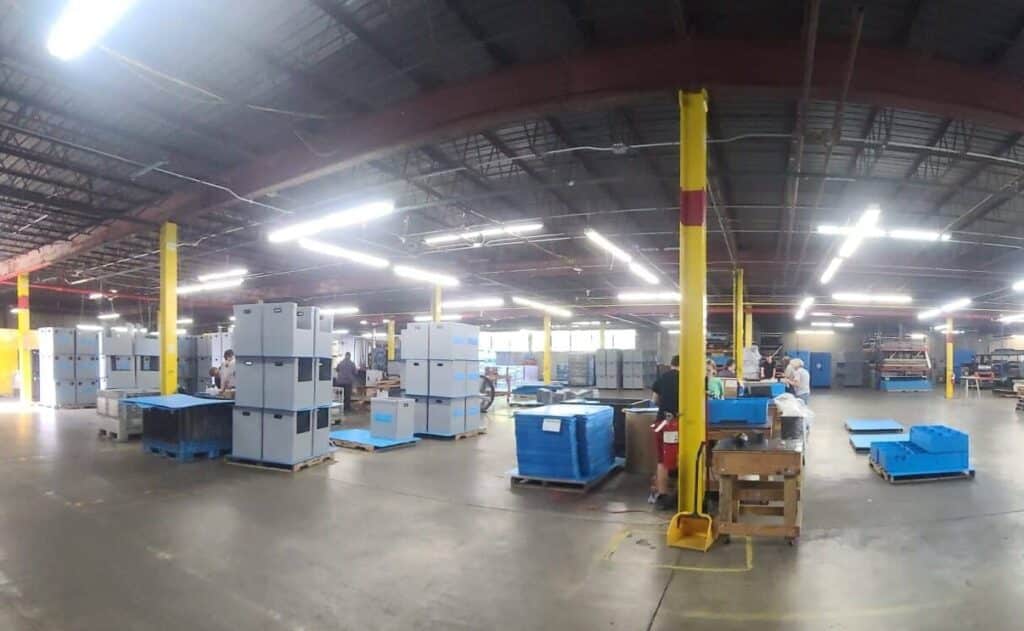 Organized warehouse interior with efficient storage solutions and bright lighting.