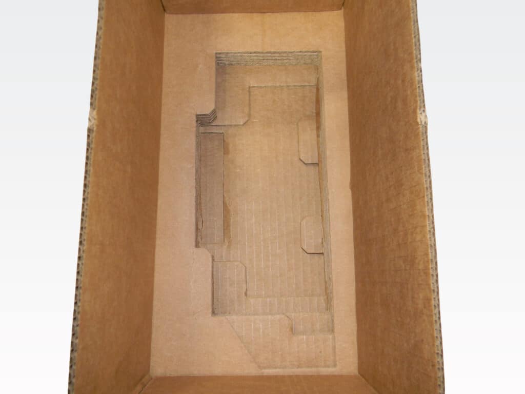 Cardboard box insert template for secure packaging and shipping of products.