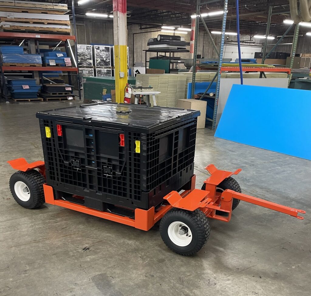 Cart for efficiently transporting plastic bins in a warehouse setting.