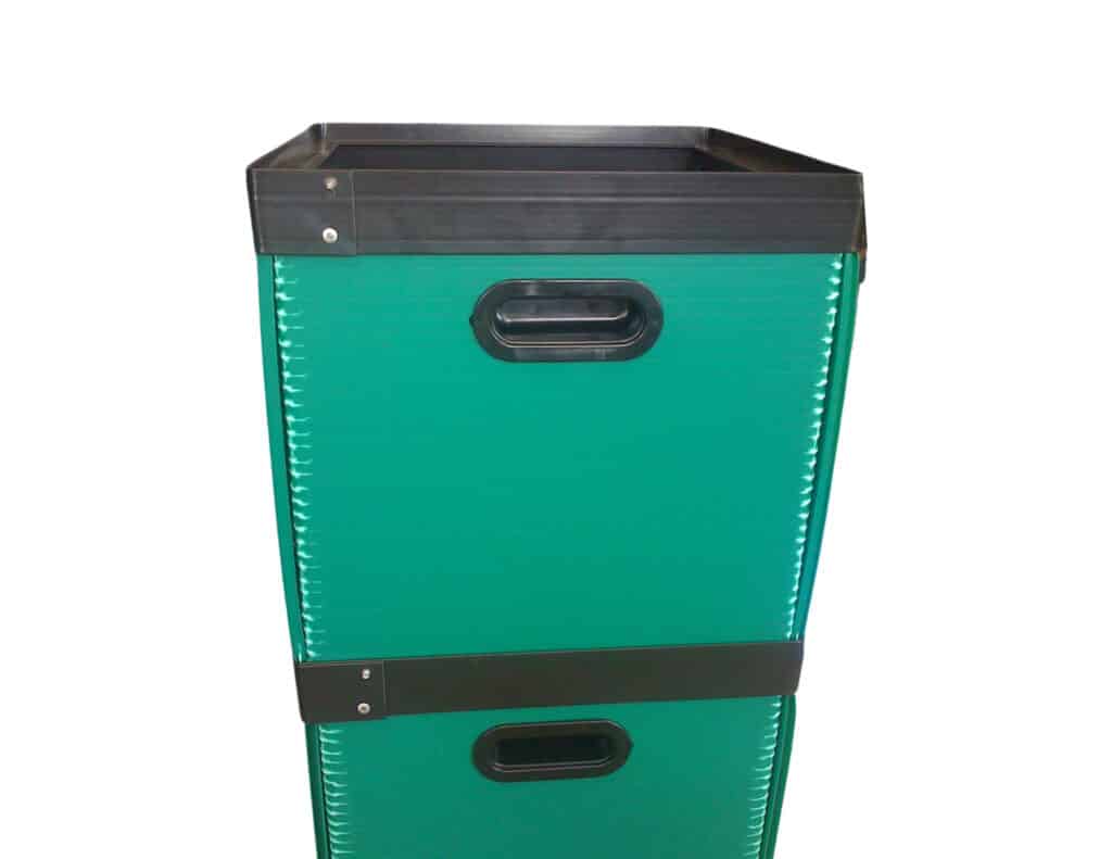 Green storage box with handles, ideal for organizing and decluttering spaces.
