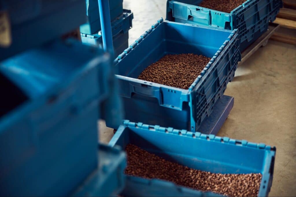Organized blue bins for efficient warehouse inventory management.