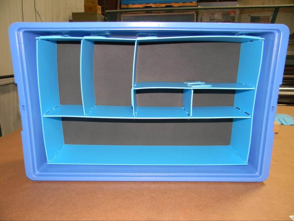 Blue organizer container with multiple compartments for efficient storage and organization.