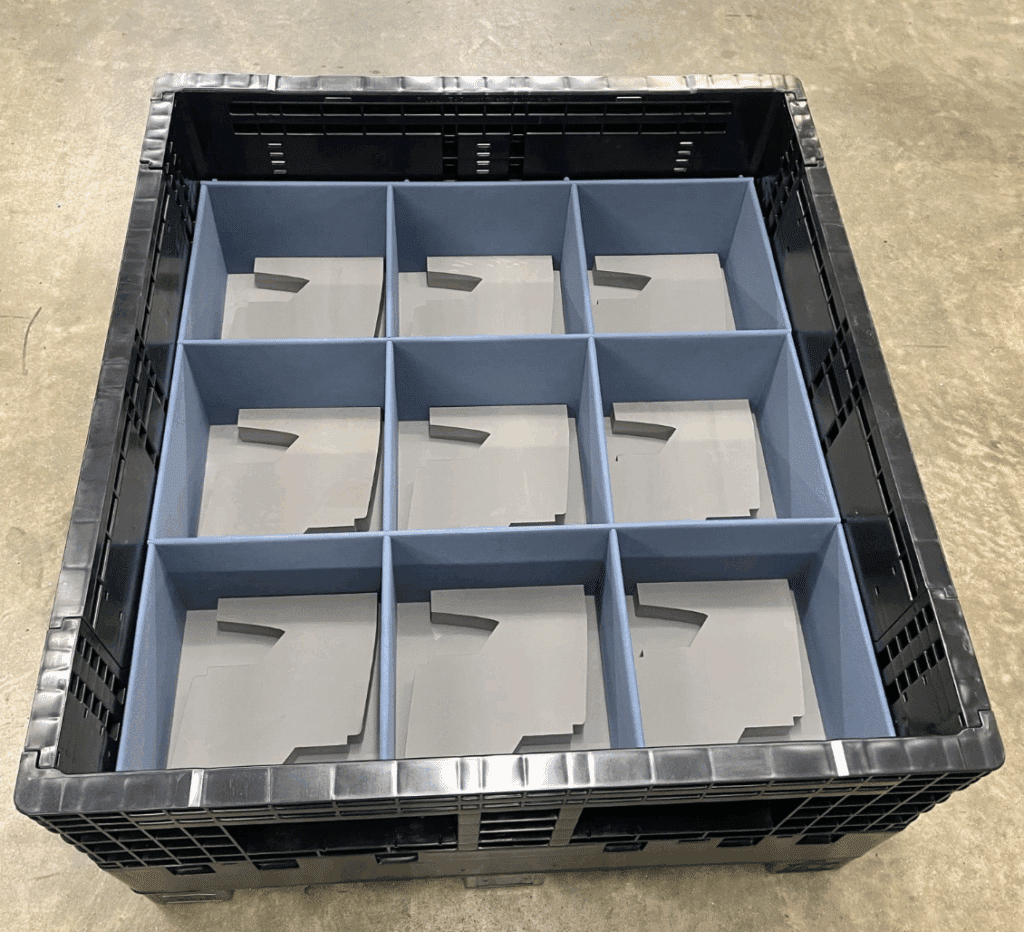 Durable black plastic storage crate with nine compartments for efficient organization.