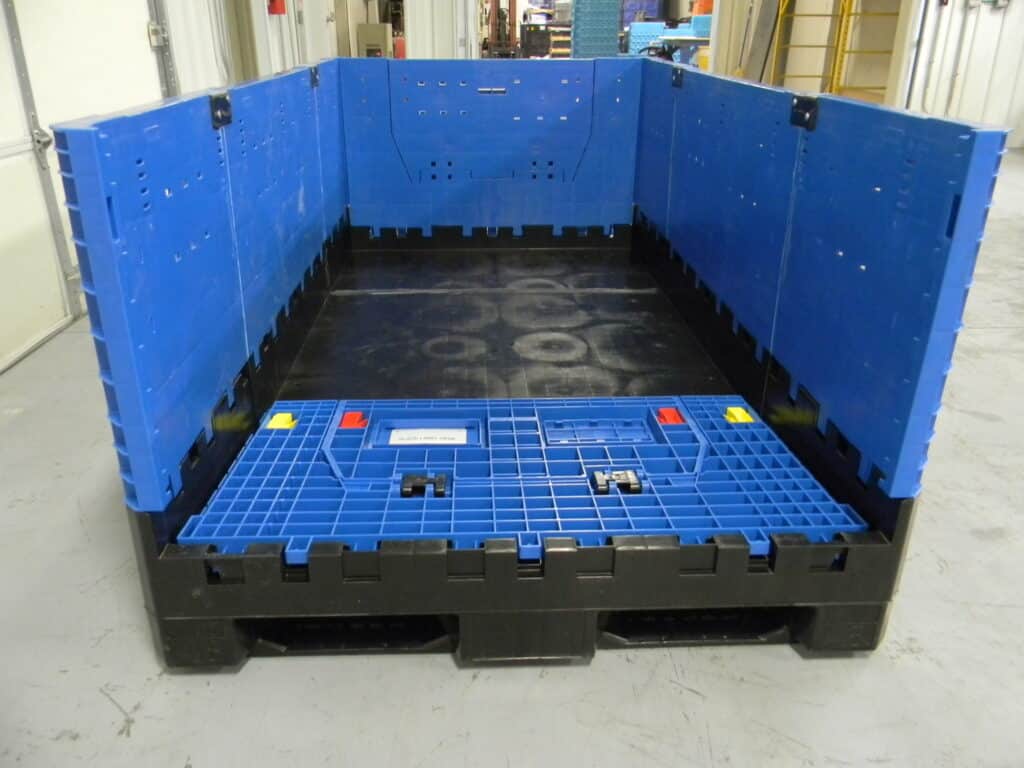 Durable blue plastic storage container designed for efficient cargo transport and organization.