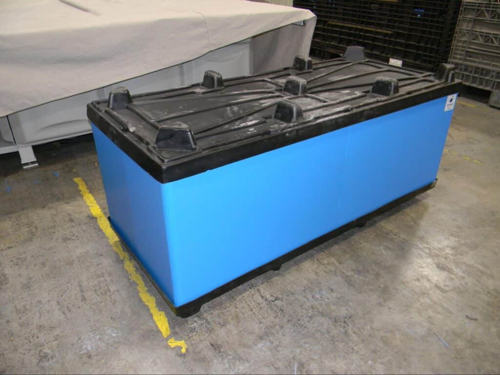 Durable blue storage box with a black lid for efficient industrial organization.