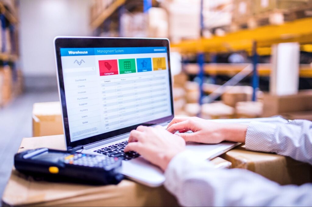 Efficient warehouse inventory tracking using laptop technology for seamless organization.