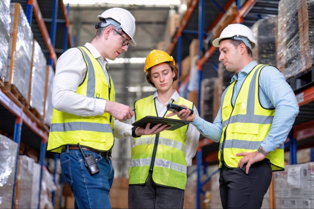 Warehouse team collaborating to improve inventory management and operational efficiency.